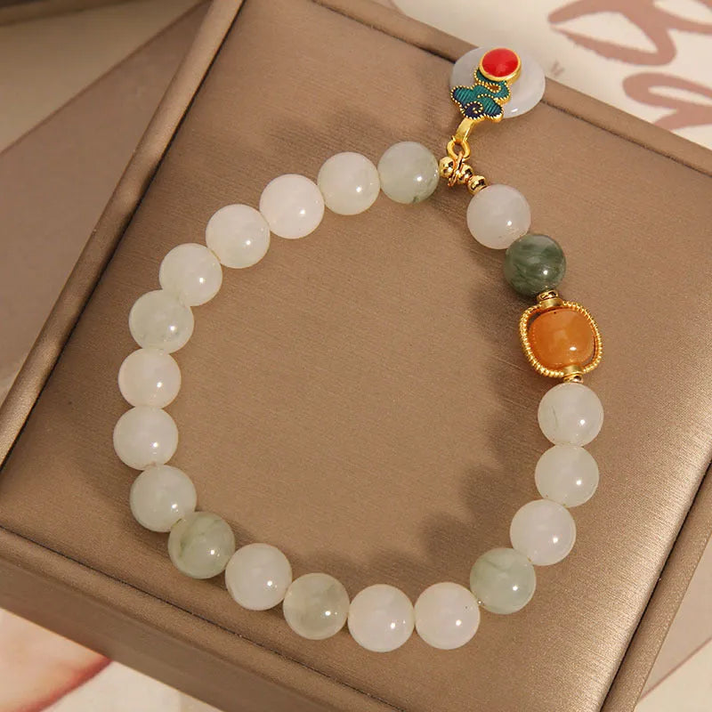 Ice jade bracelet with pearl decoration and Xiangyun peace buckle for women