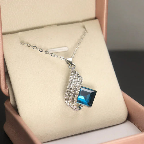 Women's alloy and glass necklace with matching ear stud set featuring cross chain design