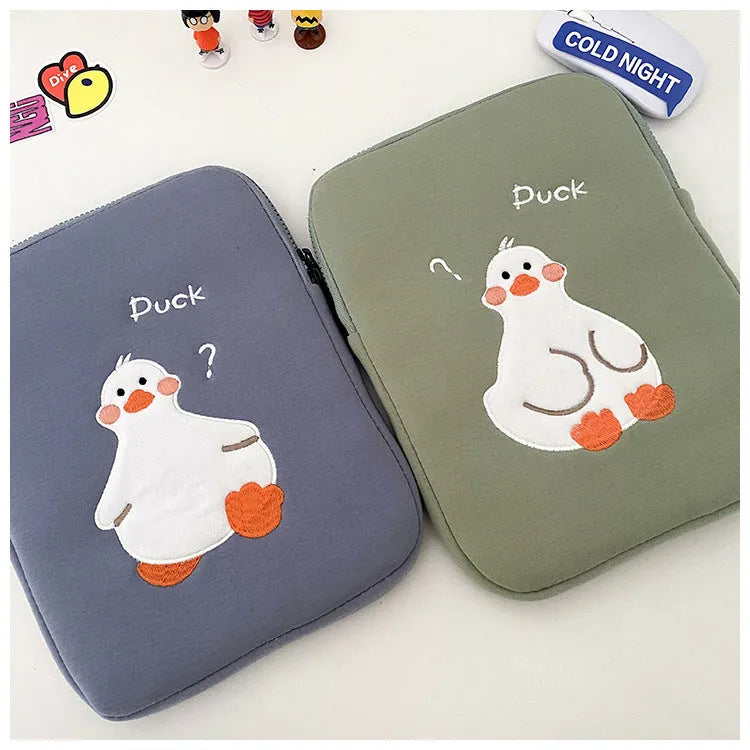 Blue tablet case with embroidered cartoon duck design and zipper closure