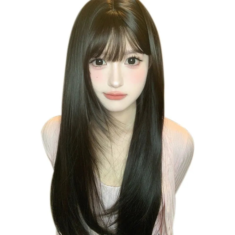 Dark brown long straight synthetic wig with bangs on wig head, showing full-head coverage