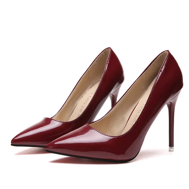 Women's pointed toe high heel pump with a stiletto heel above 8cm, shown in a nude colour with a buckle detail.