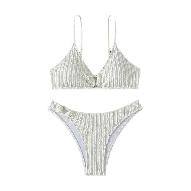 White women's v-neck swimsuit with sleeveless top and split shorts on mannequin