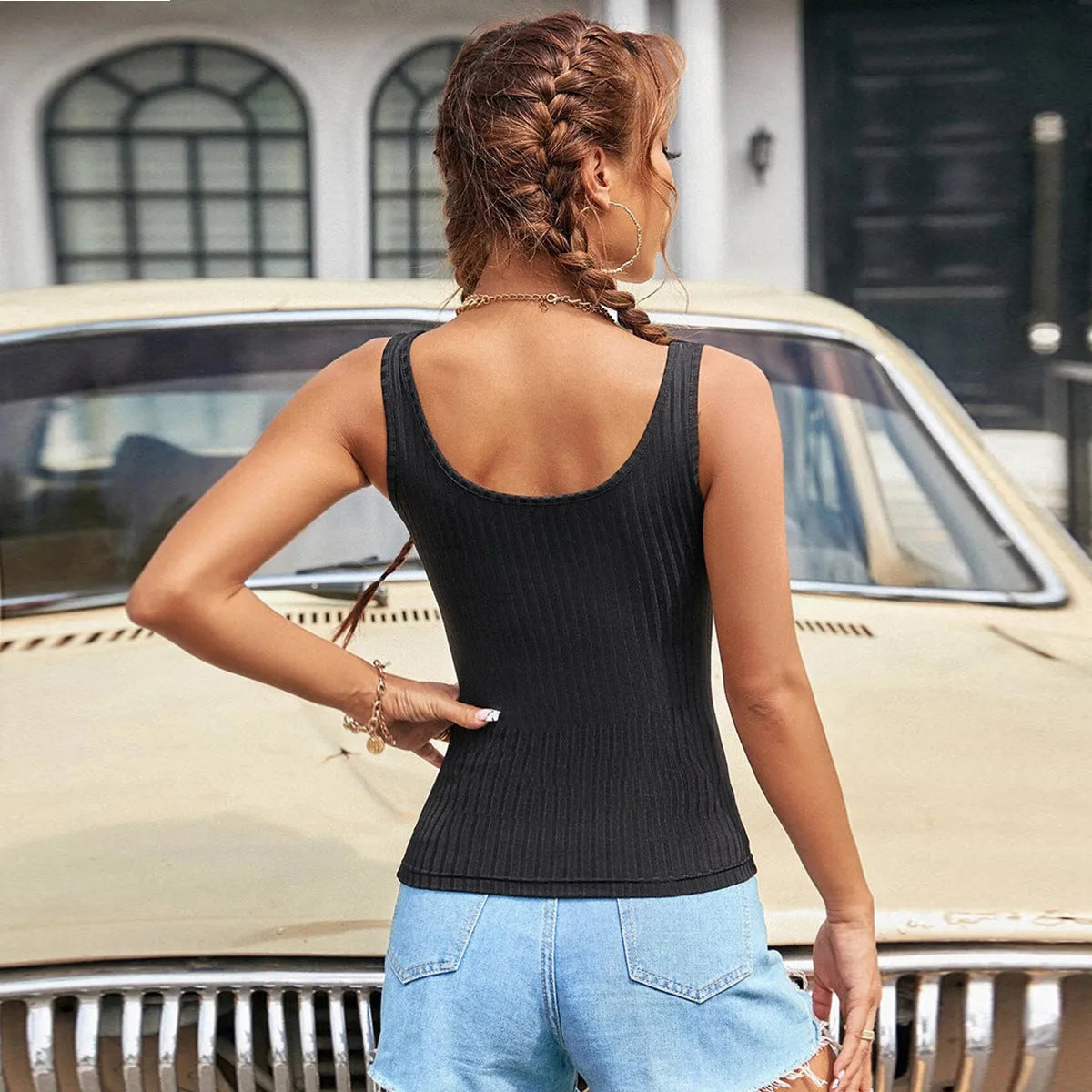Women's slim-fit solid colour polyester tank top with boat neckline and backless design in black