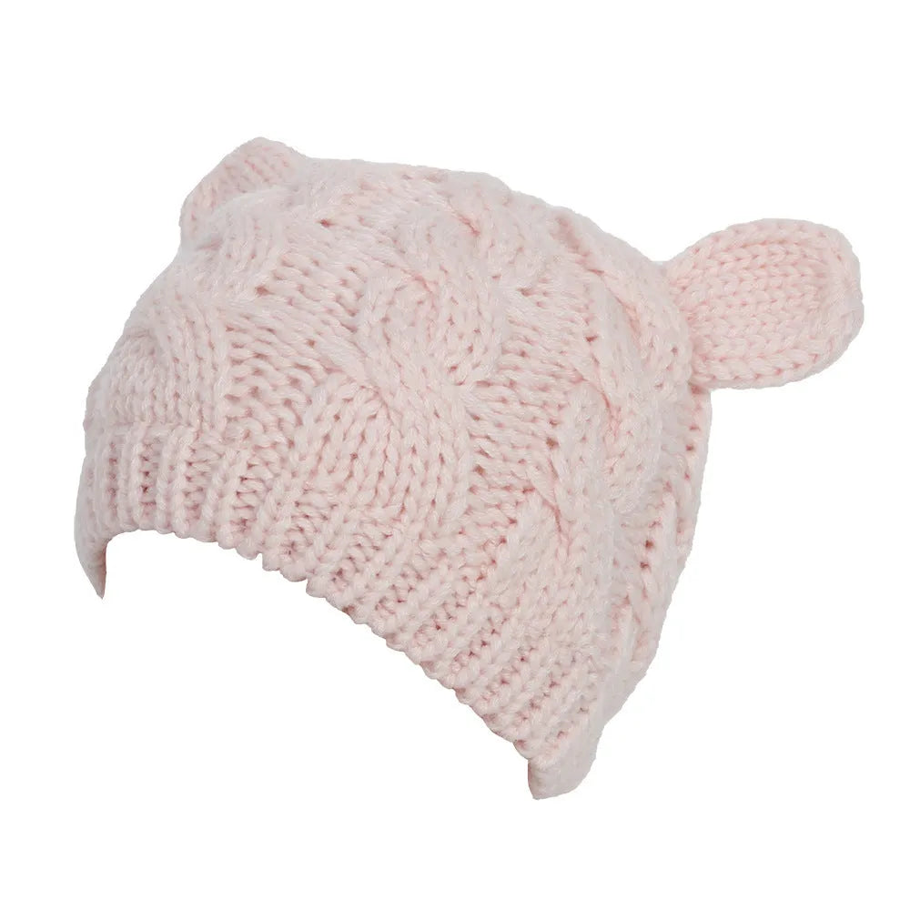 Hand made 3D knitted cat ear beanie in wool, shown in multiple colour options including red, black and beige.