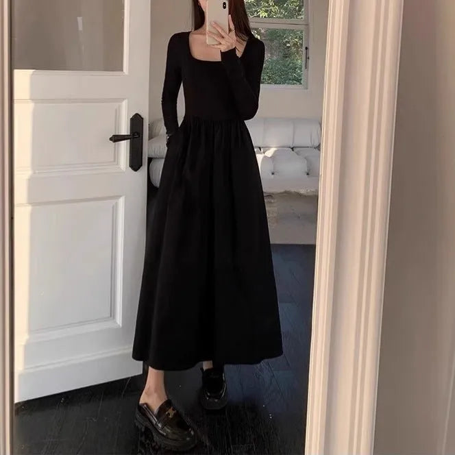 Women's black knitted dress with square collar, long sleeves, elastic waist, and A-line floor-length skirt