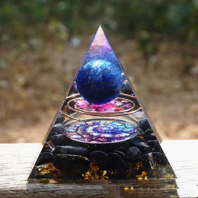 Clear epoxy resin pyramid ornament with embedded blue lapis lazuli crystal gravel, 6cm tall.