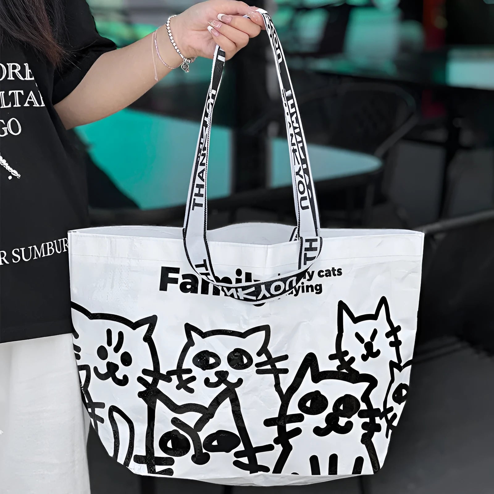 Waterproof PP woven handbag with colour printing, shown as a portable bag for clothing and cosmetics.