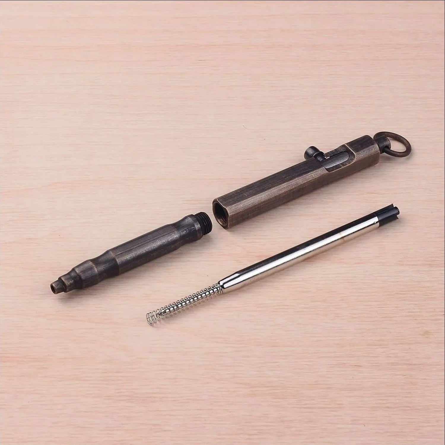 Brass hexagonal bolt tactical pen showing machined details and hexagonal design