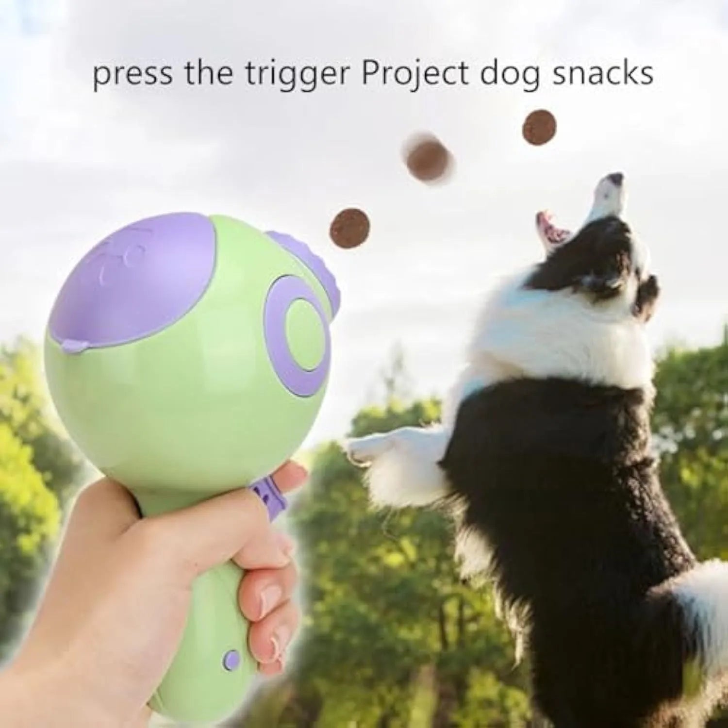 Green, orange or pink dog treat launcher toy measuring 15.5 cm with treat dispensing mechanism