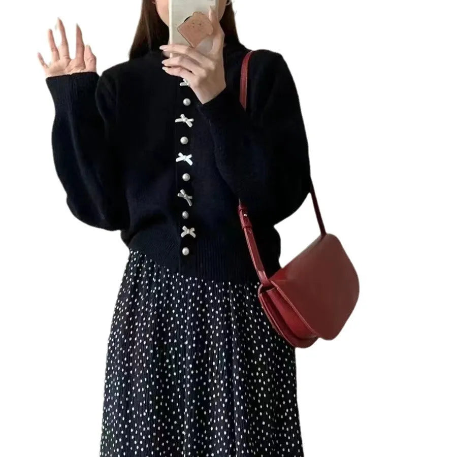 Women's solid colour cardigan with bow and pearl buttons, cashmere acrylic blend, shown in multiple colour options.