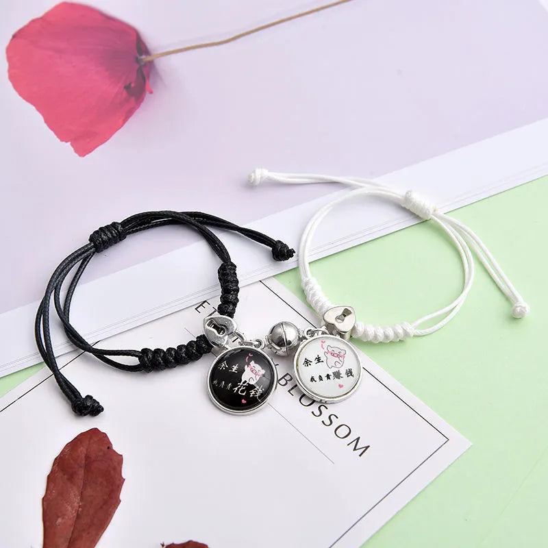 Magnetic clasp couple bracelets with alloy construction and symbolic designs including crown and love lock motifs.