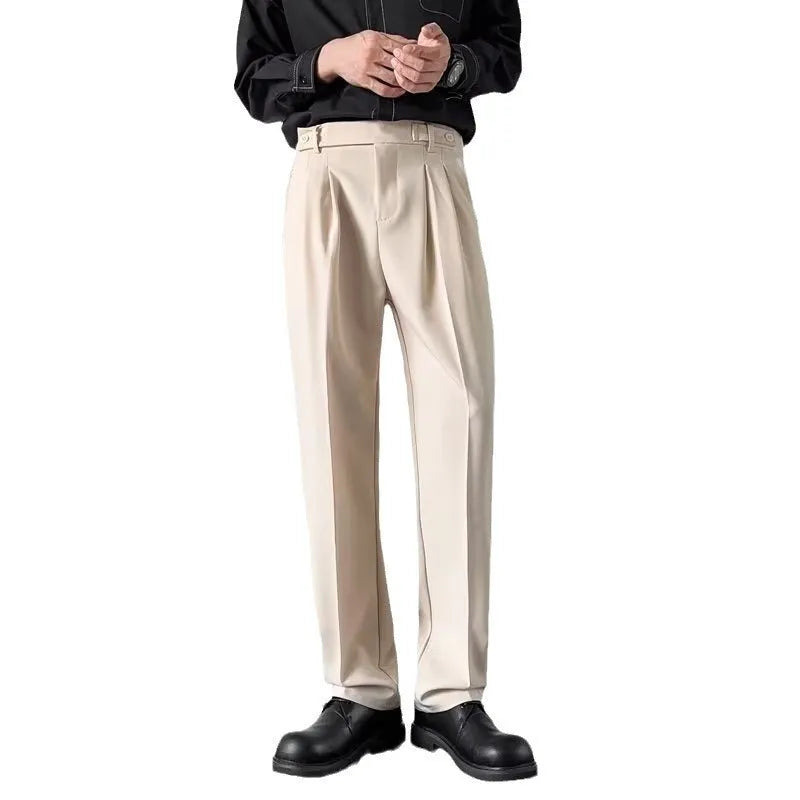 Men's apricot and black straight-leg loose fit suit trousers on a hanger