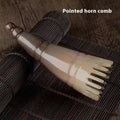 White buffalo horn meridian massage comb showing four different combing surfaces