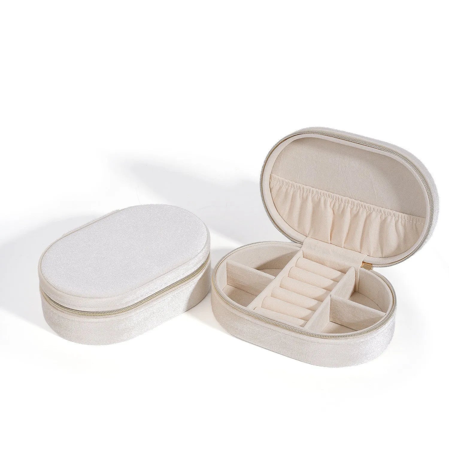 Oval velvet jewellery box with handle in lake blue colour, showing flannel-lined interior.