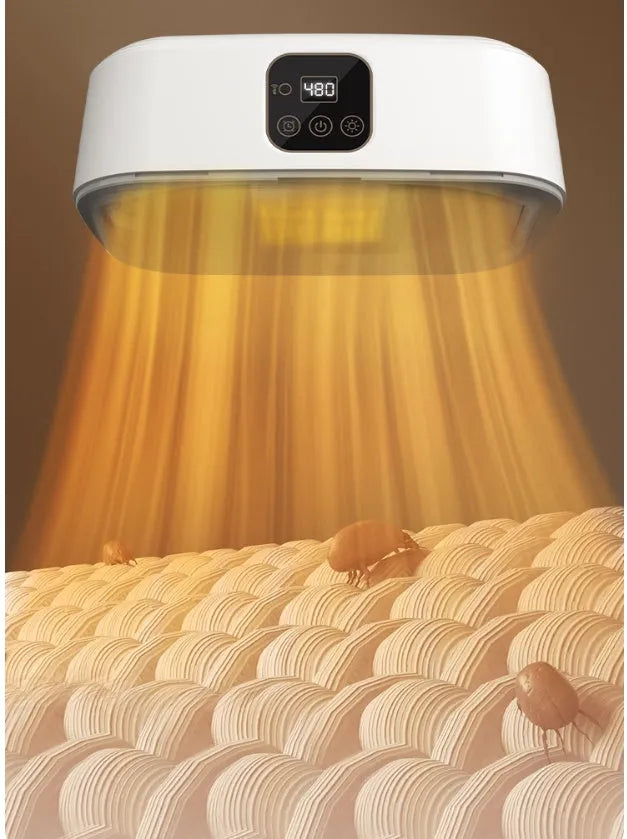 White cylindrical compact foldable laundry dryer with remote control on a table.
