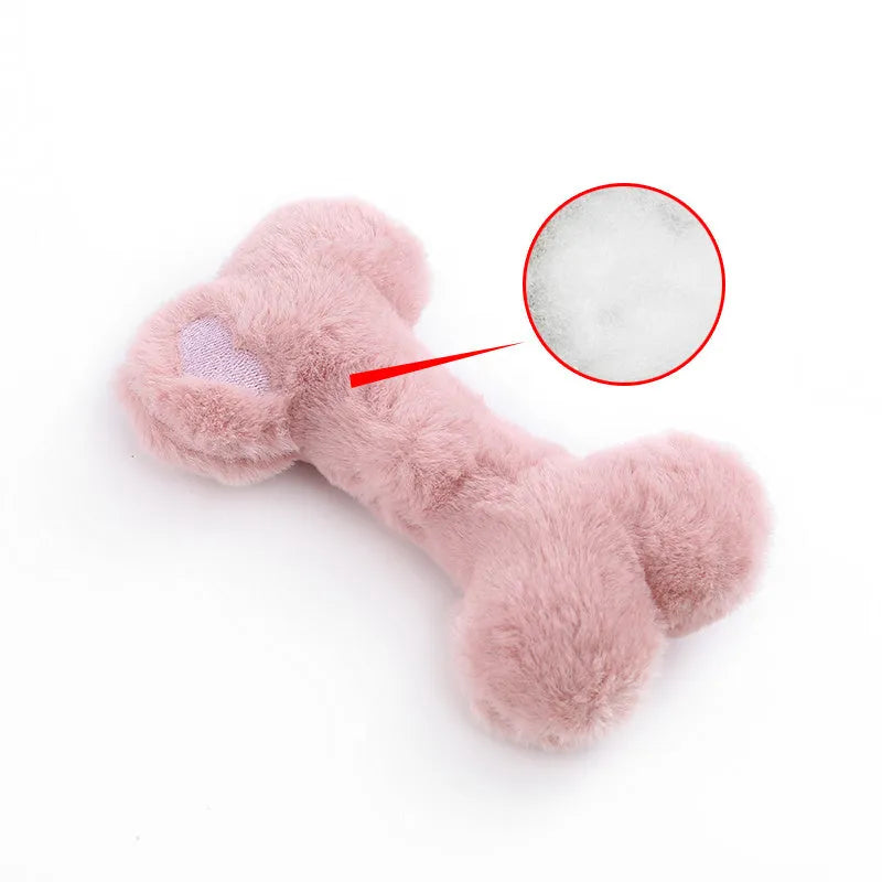 Blue Love Bone shaped plush dog toy with a squeaker on a white background.