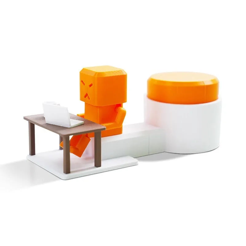 Orange plastic vent-themed table spinning decompression fidget toy on a desk.