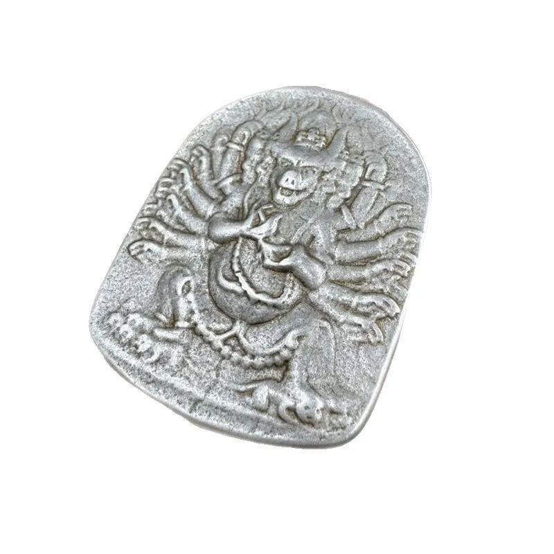 Close-up of a Chinese style iron wall pendant with geometric designs and Yamantaka figure.