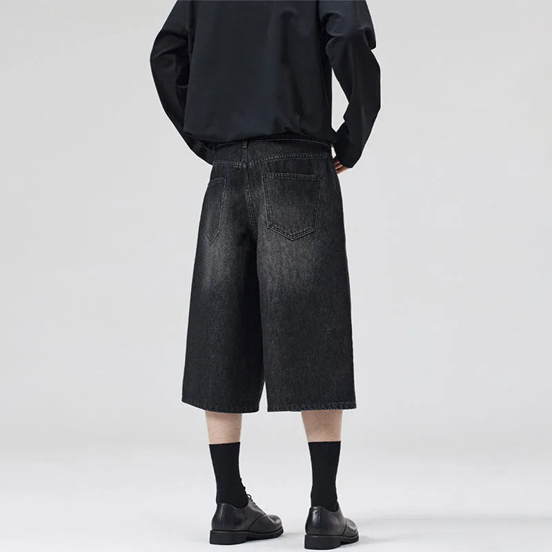 Men's loose straight-leg denim shorts in light blue colour showing cropped length and casual styling