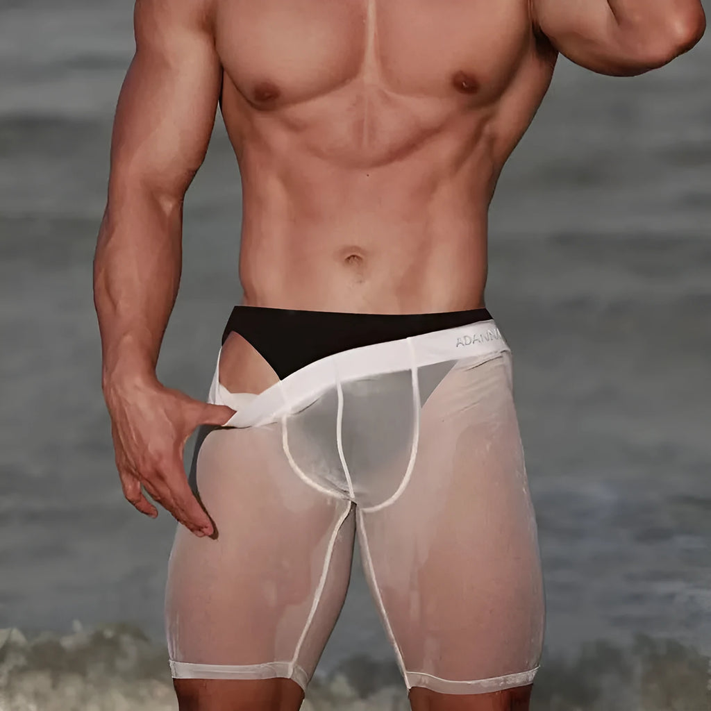 Men's solid colour nylon mesh home shorts in black, shown on a hanger.