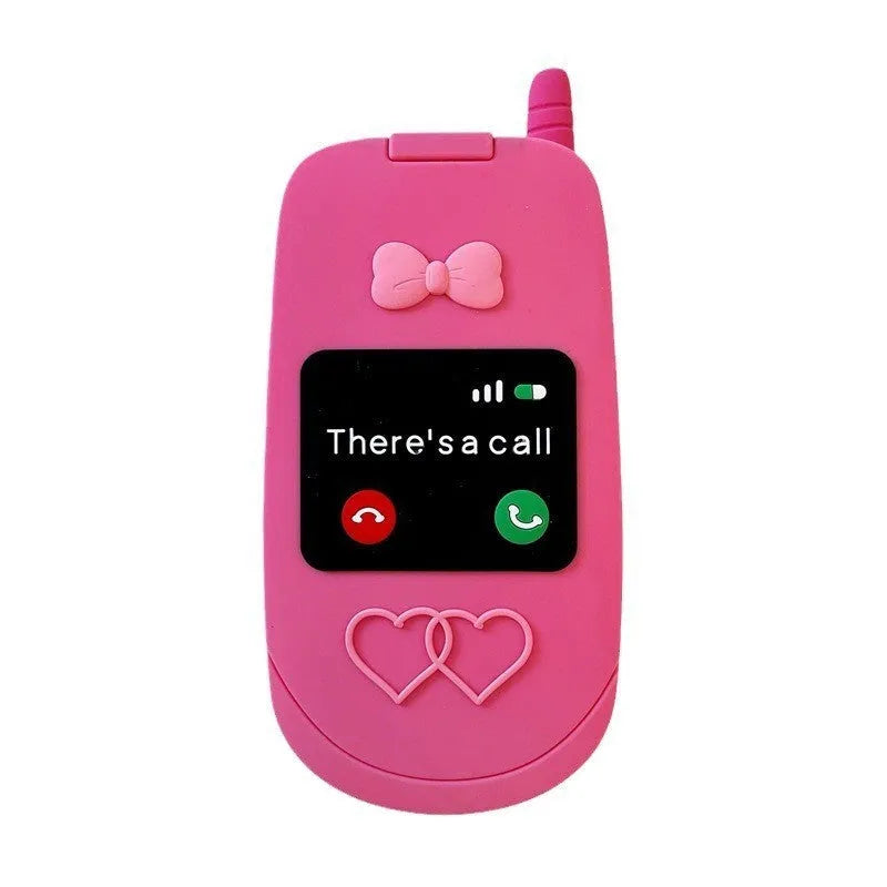 Pink silicone iPhone case shaped like a flip phone with a built-in mirror, showing cute cartoon style.