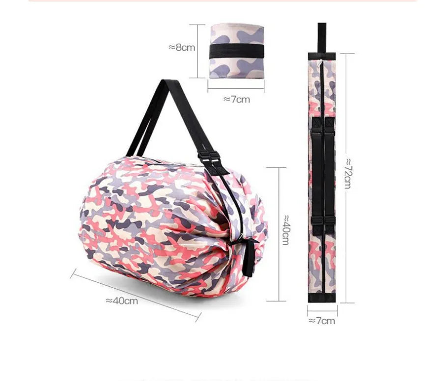 Foldable large-capacity shopping bag in 210d Oxford cloth with pink camouflage colour, hanging on a wall hook
