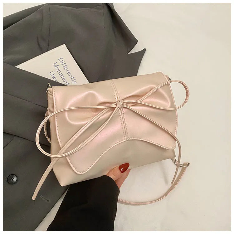 Women's underarm crossbody bag in horizontal square shape with sandwich pocket design and crossbody strap
