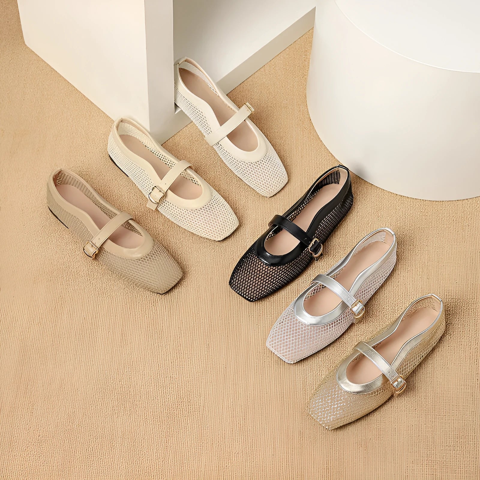 Women's beige mesh low heel pump with a buckle strap and square toe on a neutral background.
