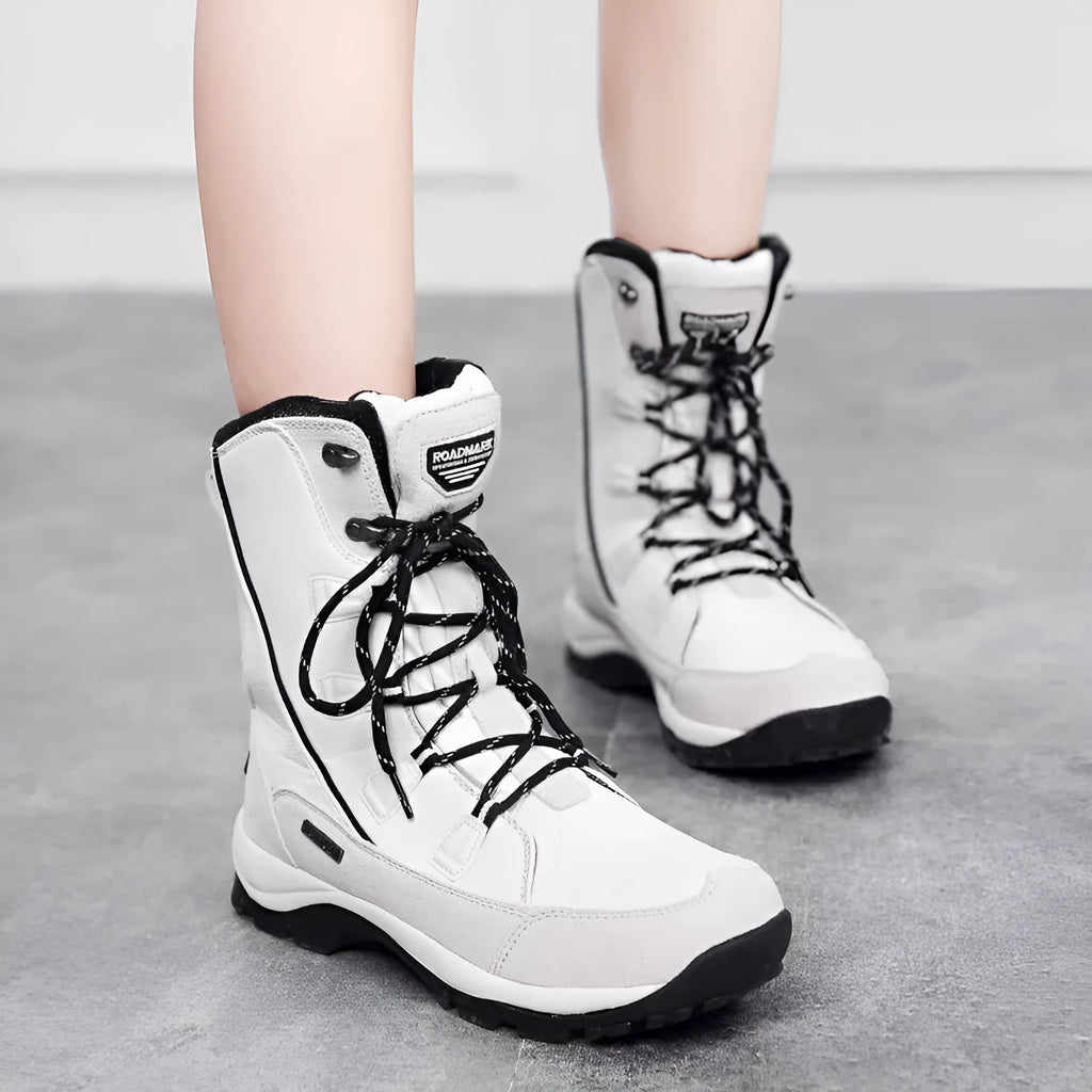 Women's genuine leather thermal snow boots in black colour with mid-calf length and round toe design