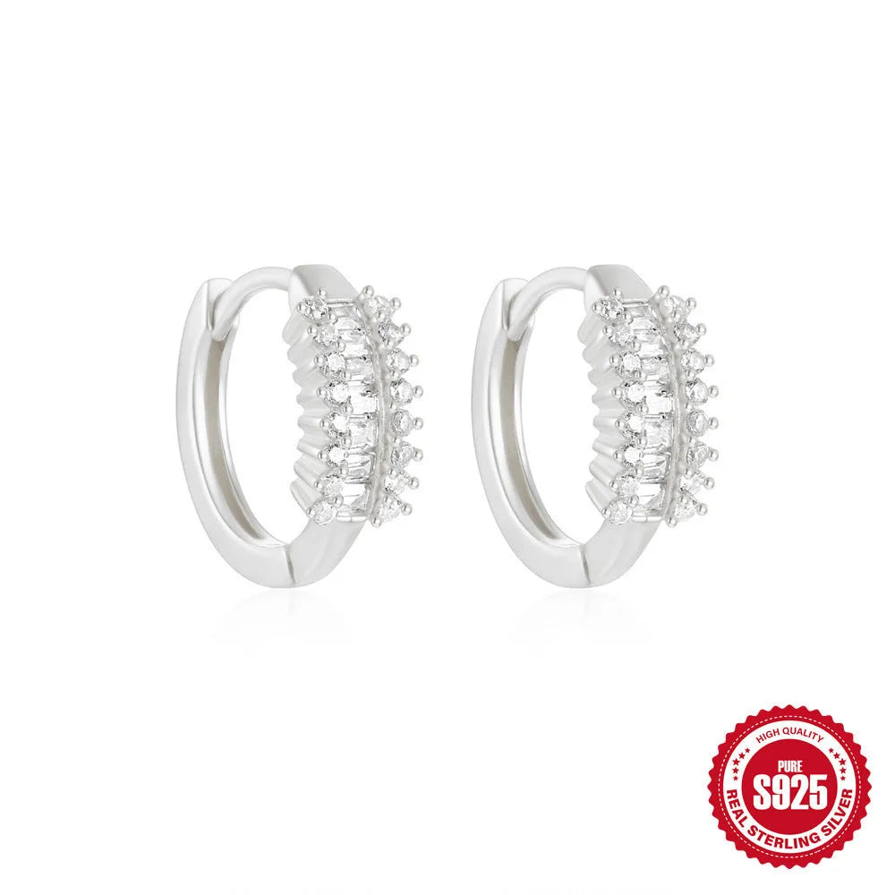 Sterling silver geometric stud earrings with round diamond accents in gold and silver electroplated finishes