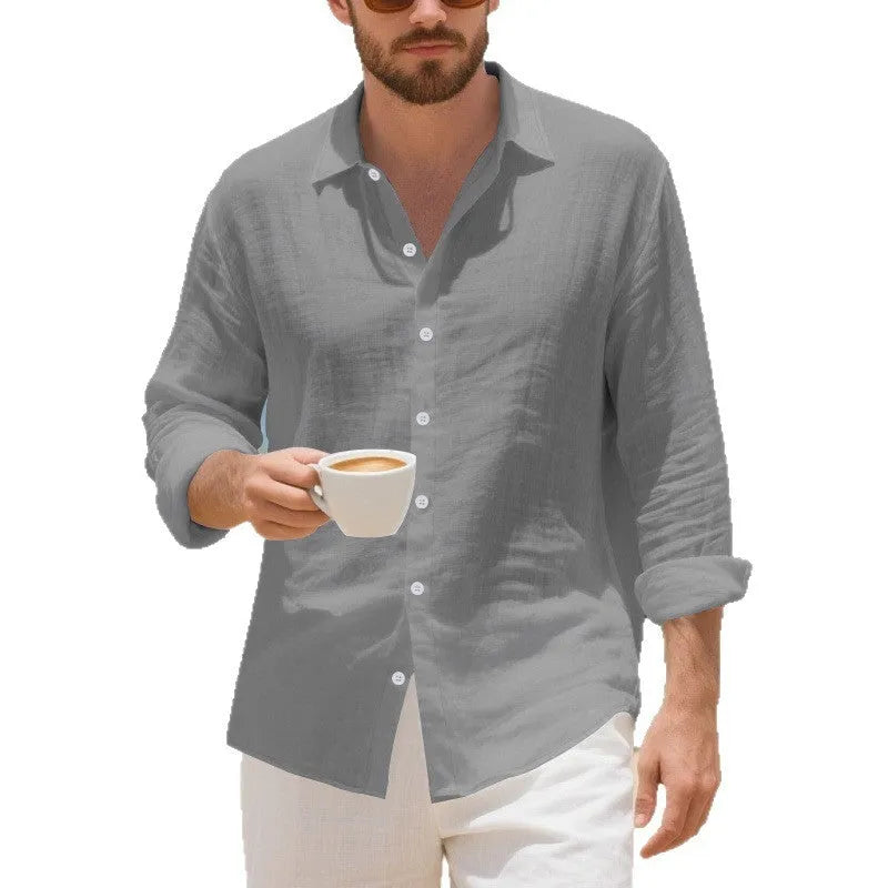 Men's loose fit linen Hawaiian casual shirt on a hanger, shown in light blue colour.