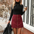 Women's high waist short skirt in black with front zipper and stitching detail