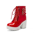 Women's black thick-heeled short boots with lace-up front and round toe on a waterproof platform.