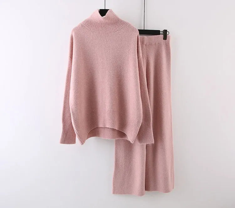 Women's casual two-piece set showing sweater and wide leg trousers in solid colour with thread detail