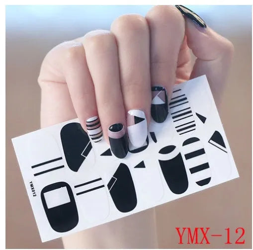 Full nail stickers set of 14 sheets showing 16 colour options in a flat lay arrangement
