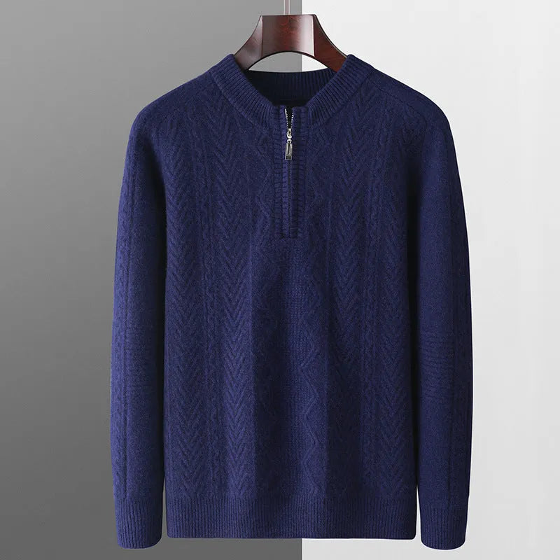Men's grey wool half zip sweater with a diamond lattice pattern, shown on a model.