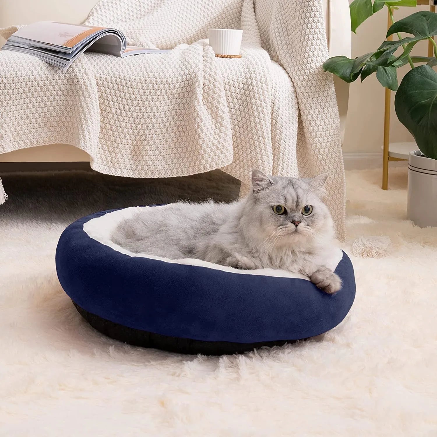 Circular warm soft pet nest dog bed in gray cloth with raised rim, size S, on a wooden floor