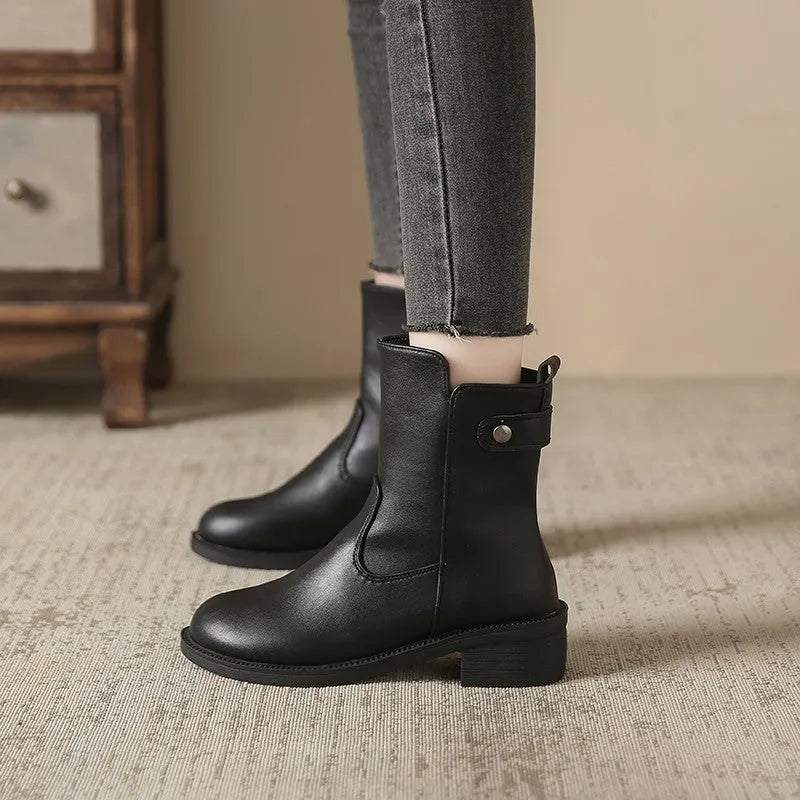 Black women's ankle boots with side zip, round toe, and a low block heel.