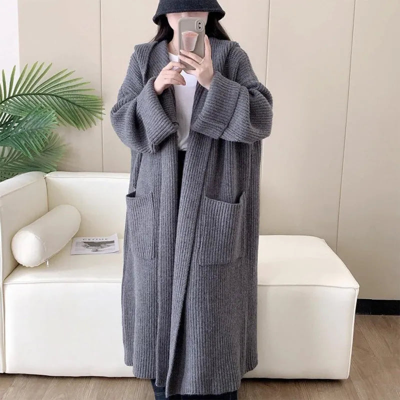 Women's loose hooded cardigan coat in acrylic fabric with raglan sleeves.