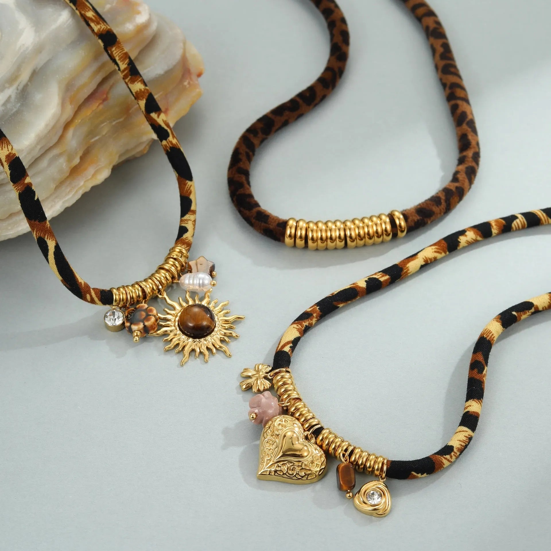 Leopard Series geometric stainless steel necklace with gold electroplated finish on a white background.