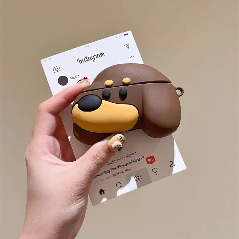 Brown puppy silicone earphone case on AirPods charging case with embossed cartoon design
