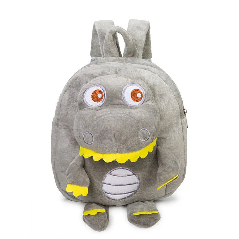 Soft blue dinosaur plush backpack for children with embroidered dinosaur pattern and a soft handle.