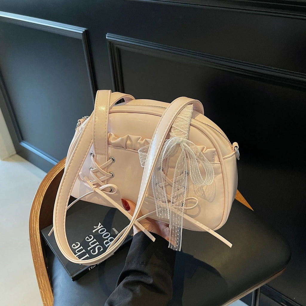 Women's casual PU shoulder handbag with a bandage bow and internal phone pocket in beige, black, blue, or pink.