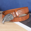 Cow head buckle men's imitation leather belt in black and brown colour options showing decorative alloy buckle detail
