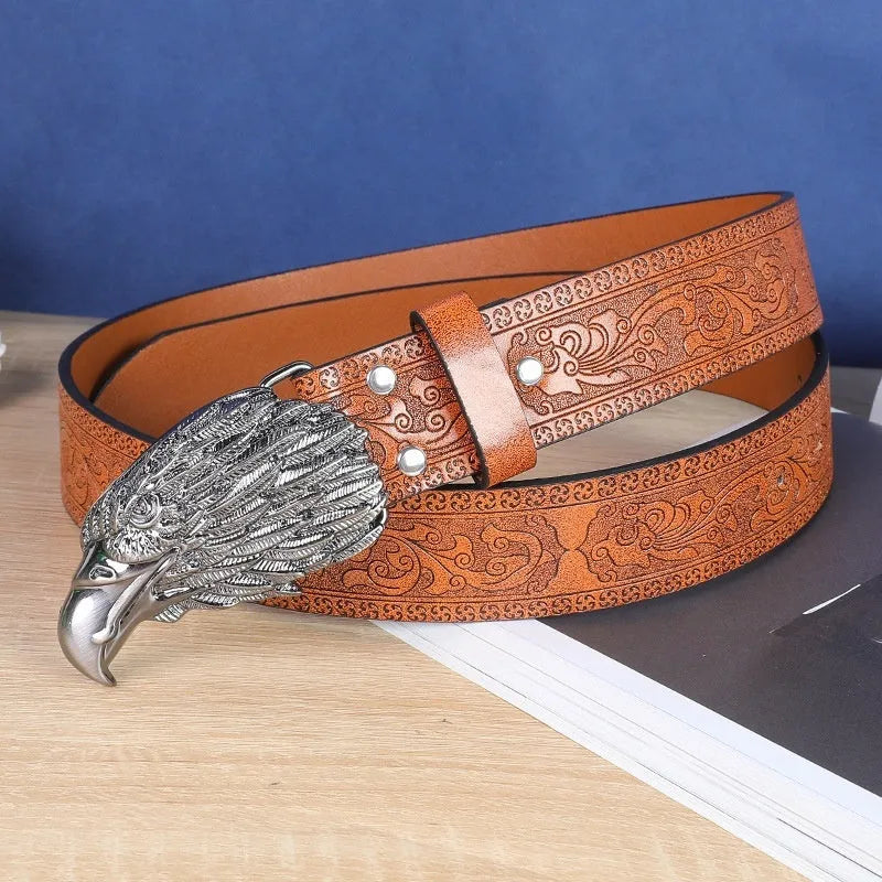 Cow head buckle men's imitation leather belt in black and brown colour options showing decorative alloy buckle detail