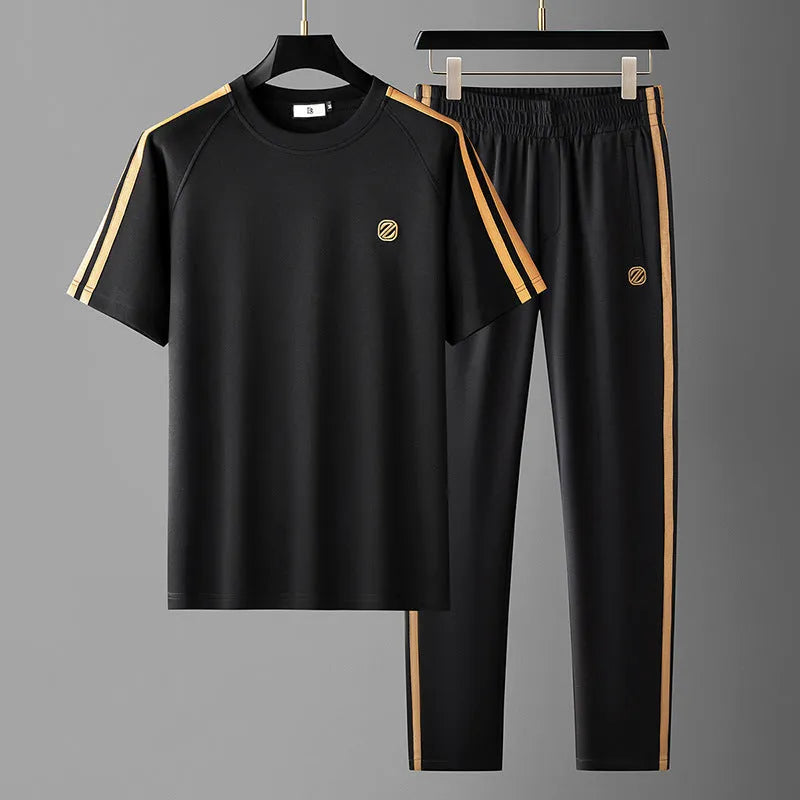 Men's blue short sleeve polyester suit with separate top and trousers for sports wear