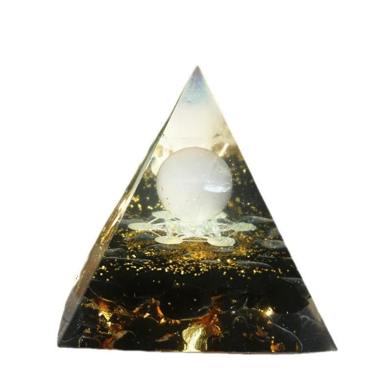 Clear epoxy resin pyramid ornament with embedded blue lapis lazuli crystal gravel, 6cm tall.