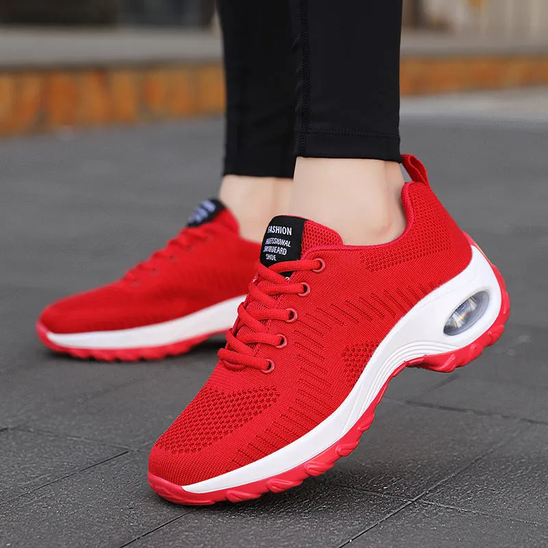 Women's red and black low top mesh sneakers with round toe and front lace-up design showing 3-5cm heel