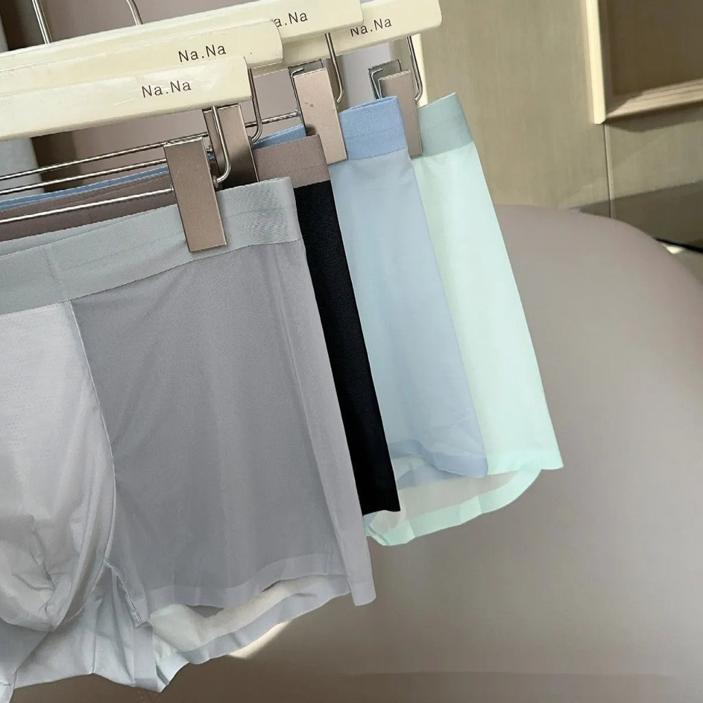 Seamless men's boxer shorts in ultra-thin ice silk nylon fabric, showing honeycomb crotch design.