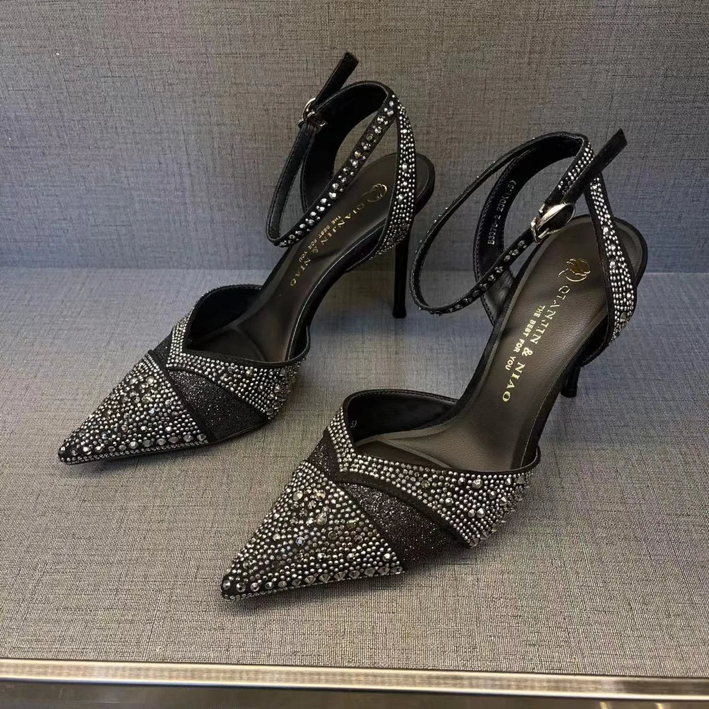 Women's black and silver hollow high heels with red soles, stiletto heels, and pointed toe design
